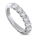 Platinum diamond ring side view with five round diamonds in prong setting