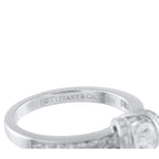 Platinum ring band detail with engraved Tiffany & Co. hallmark and diamond ribbon