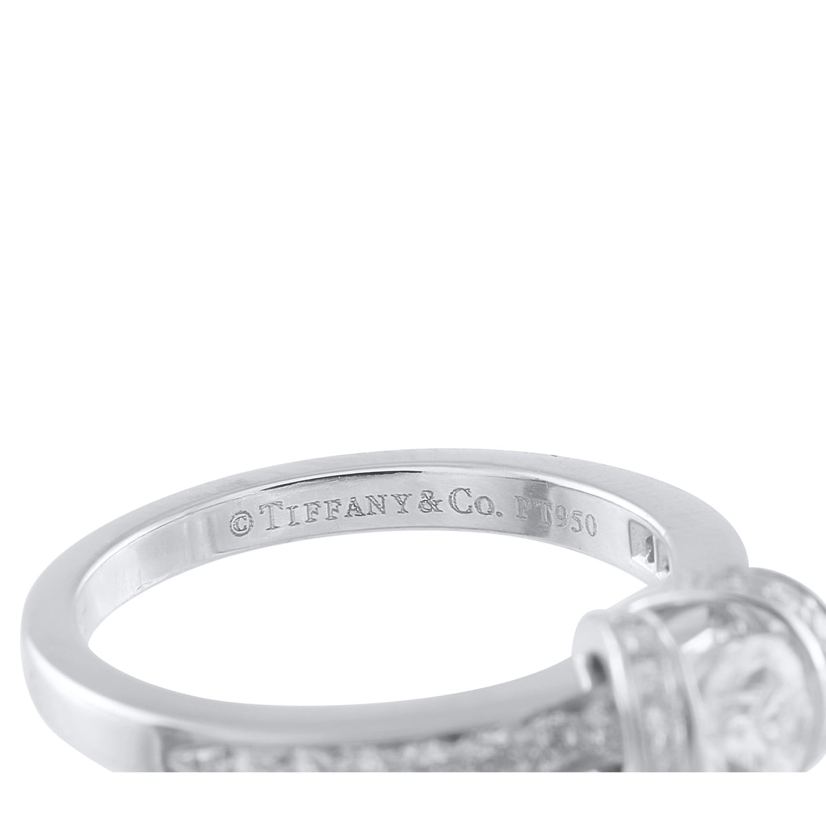 Platinum ring band detail with engraved Tiffany & Co. hallmark and diamond ribbon