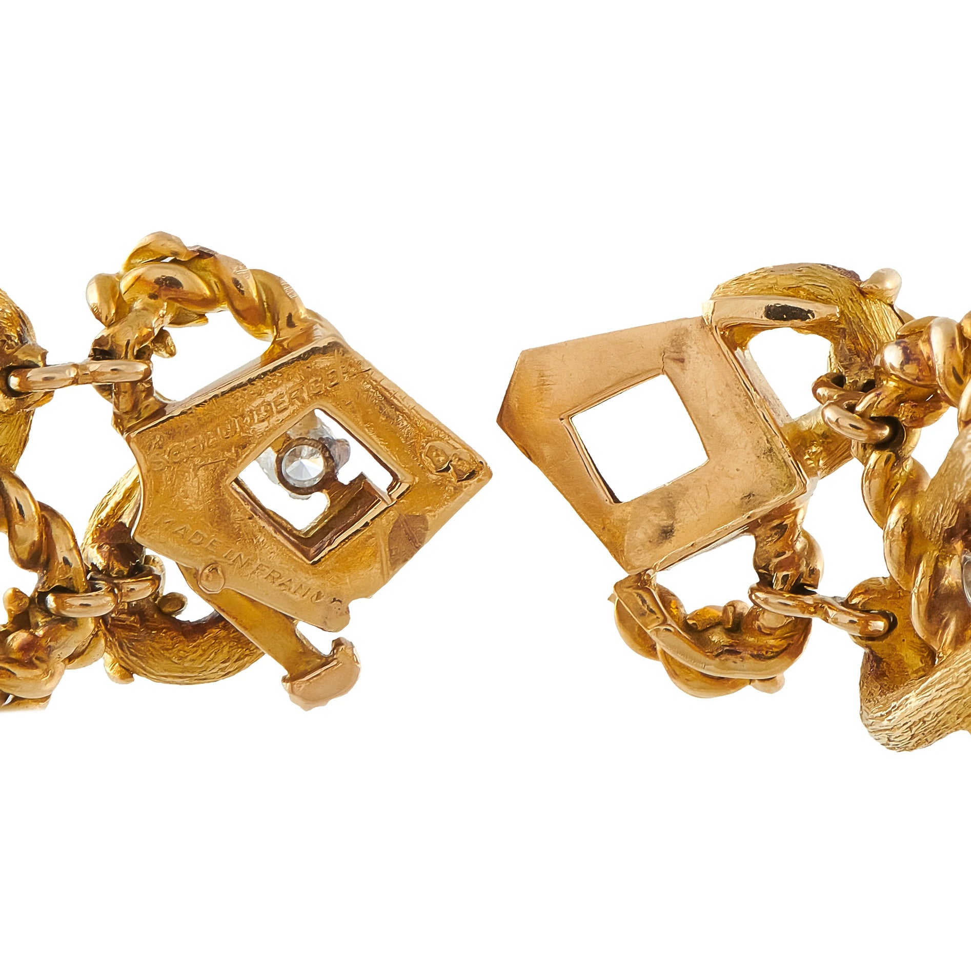 18K yellow gold geometric bracelet links with diamond accents and chain detail