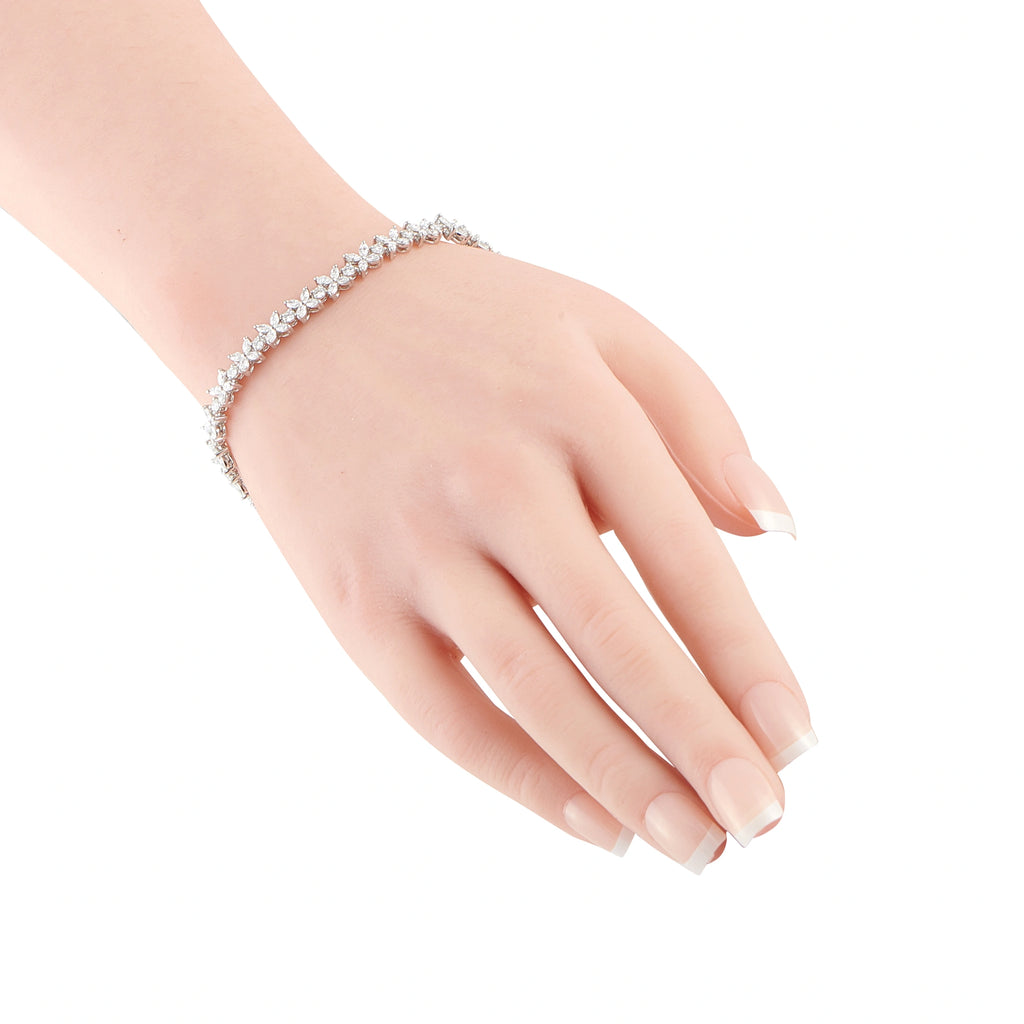Tiffany & Co. Victoria diamond bracelet worn on the wrist, with a delicate floral-link design
