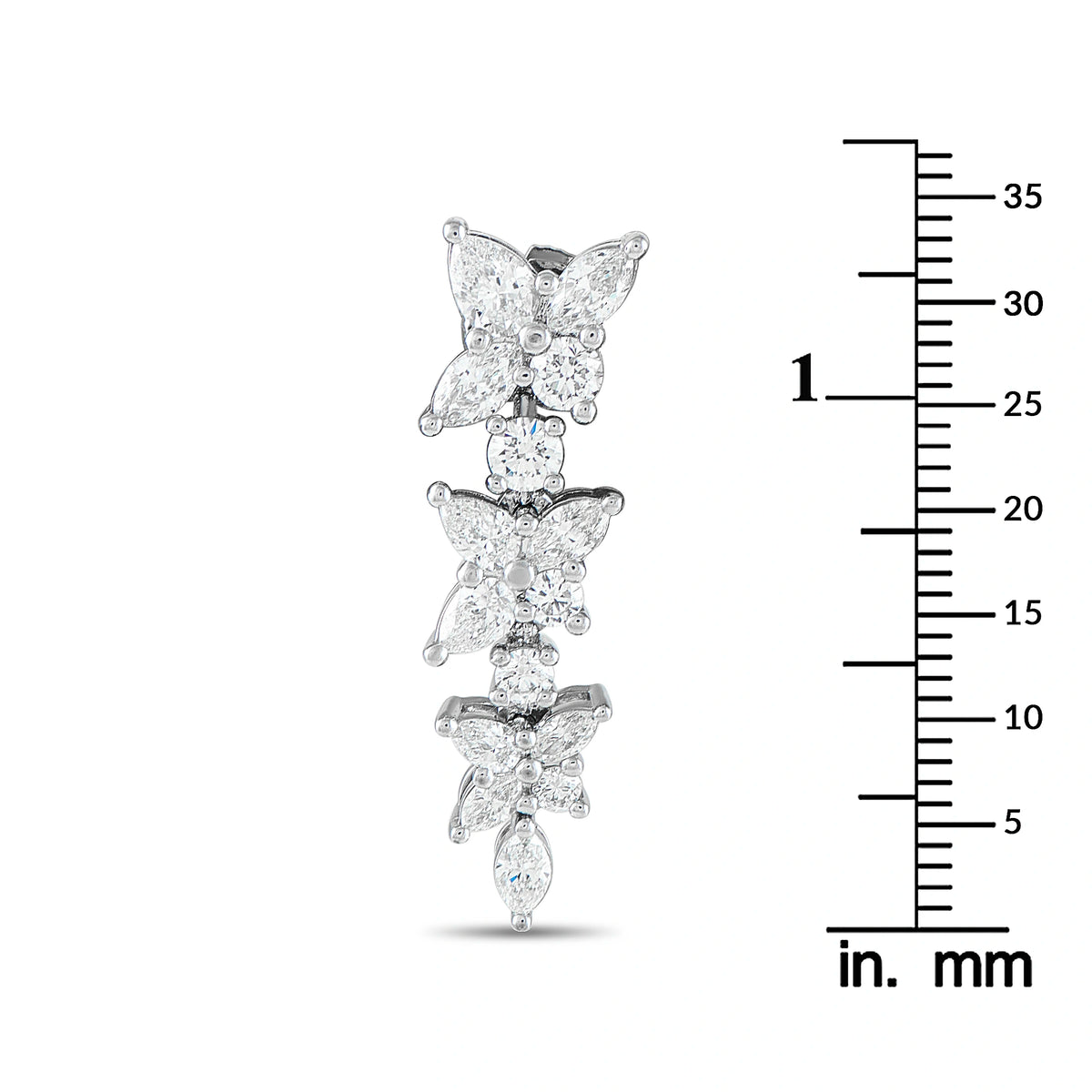 Tiffany & Co. Victoria diamond drop earring beside a measurement scale