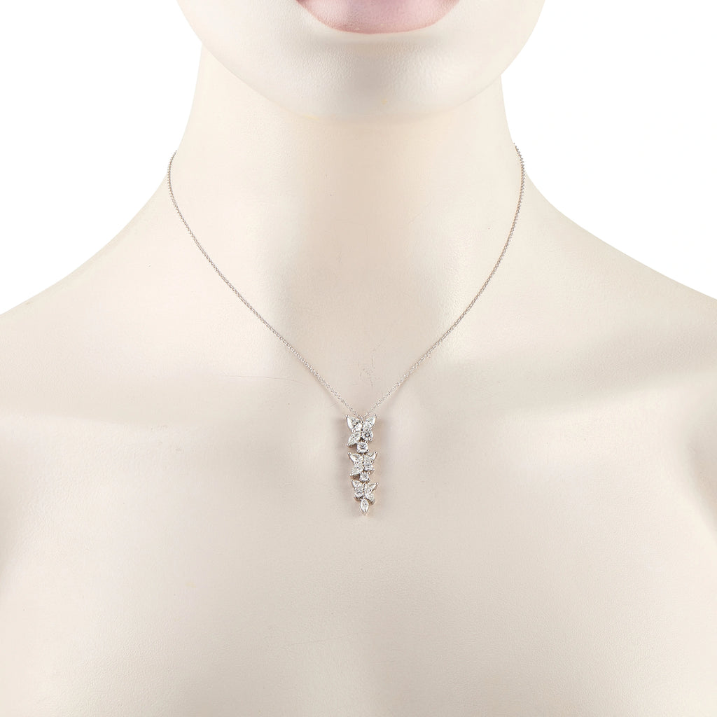 Tiffany & Co. Victoria diamond necklace worn on a display bust, showing its petite floral pendant