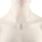 Tiffany & Co. Victoria diamond necklace worn on a display bust, showing its petite floral pendant