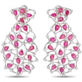Ruby and diamond drop earrings in white gold, pink oval stones on a lattice