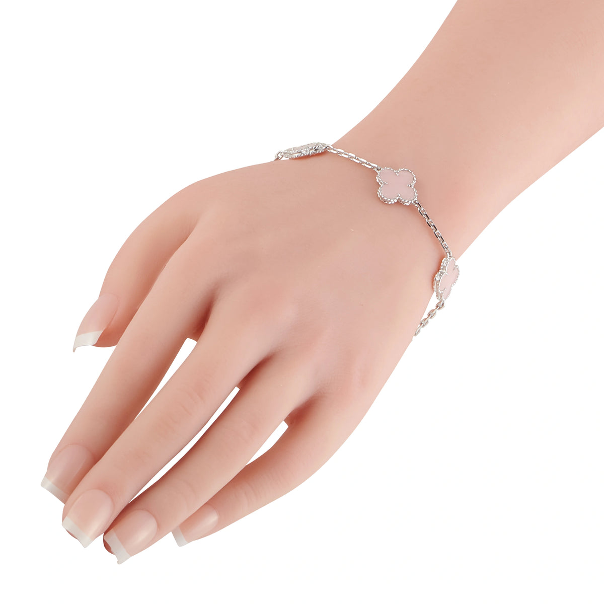 18K white gold pink opal clover bracelet with chain links, worn on wrist