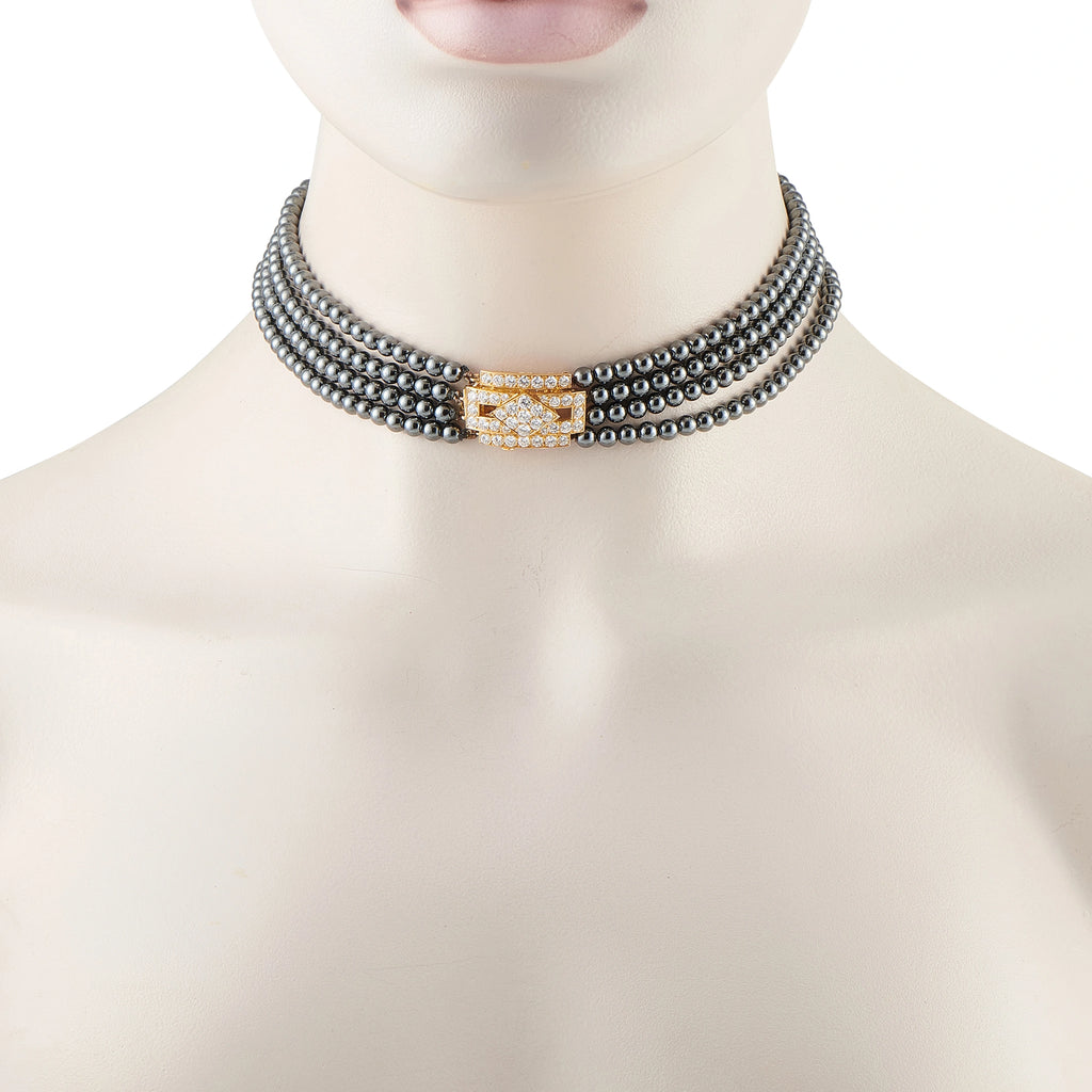 Van Cleef & Arpels hematite bead choker with a diamond-set yellow gold clasp, shown worn