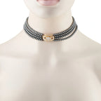Van Cleef & Arpels hematite bead choker with a diamond-set yellow gold clasp, shown worn