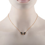 Butterfly onyx pendant on 18K yellow gold chain worn on neck