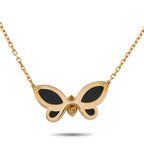 Yellow gold butterfly pendant with dark onyx wings and diamond accent, on chain