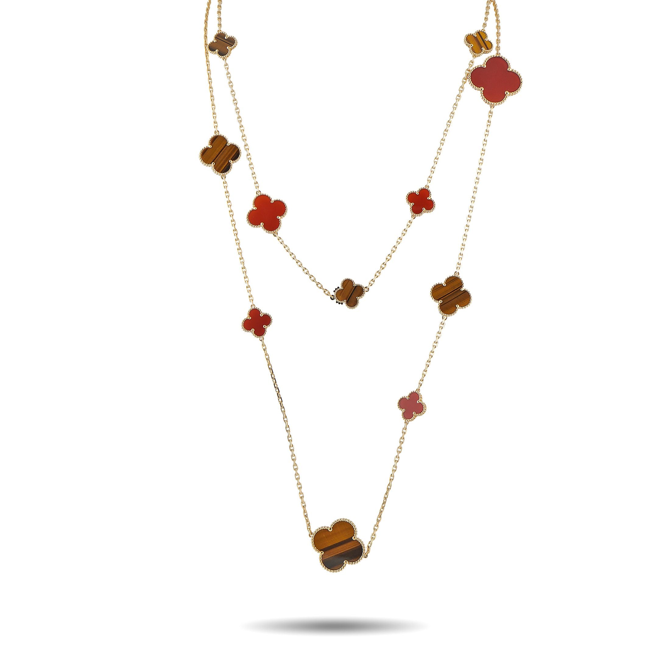 Van Cleef & Arpels Alhambra 18K Yellow Gold Carnelian and Tiger’s Eye 16-Motif Necklace - This Van Cleef & Arpels Alhambra necklace is a luxury piece that will continually captivate. Set in 18K Yellow Gold, 16 of th
