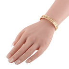 Rose gold diamond bracelet worn on wrist with clover motifs and small stones