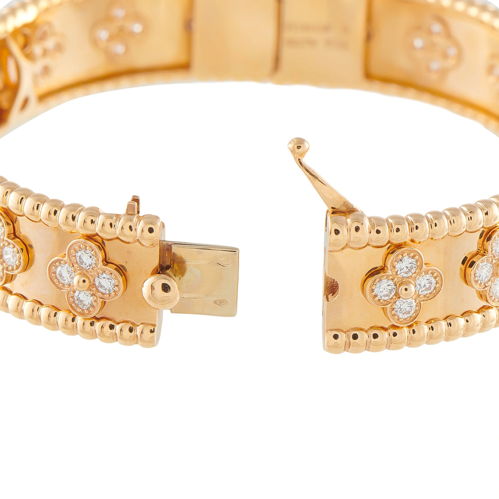 Rose gold diamond bracelet clasp detail with diamond clover charms