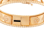 Rose gold diamond bracelet with engraved center clasp and clover motif panels