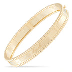 Van Cleef & Arpels yellow gold bangle with beaded edges and engraved inner band