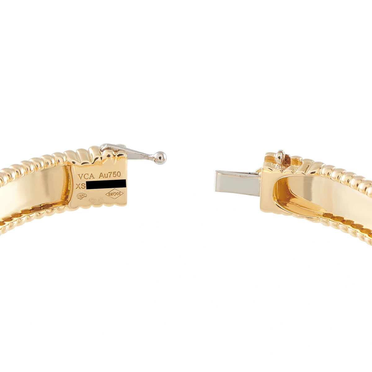Yellow gold bangle clasp opened to show the Au750 stamp
