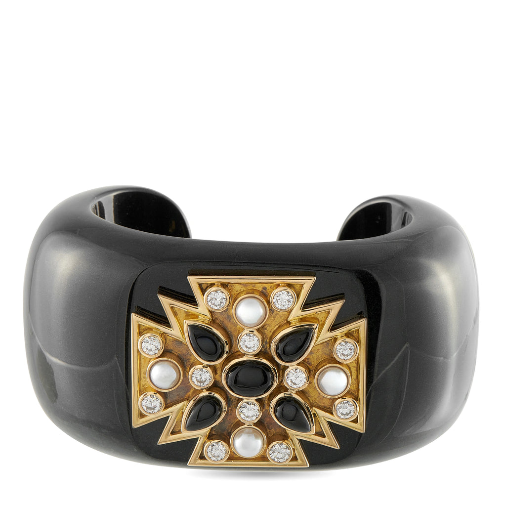 Black cuff bracelet with Maltese cross gemstone design in gold and white stones