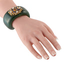 Verdura green nephrite cuff bracelet worn on hand; gold Maltese cross multi-gems