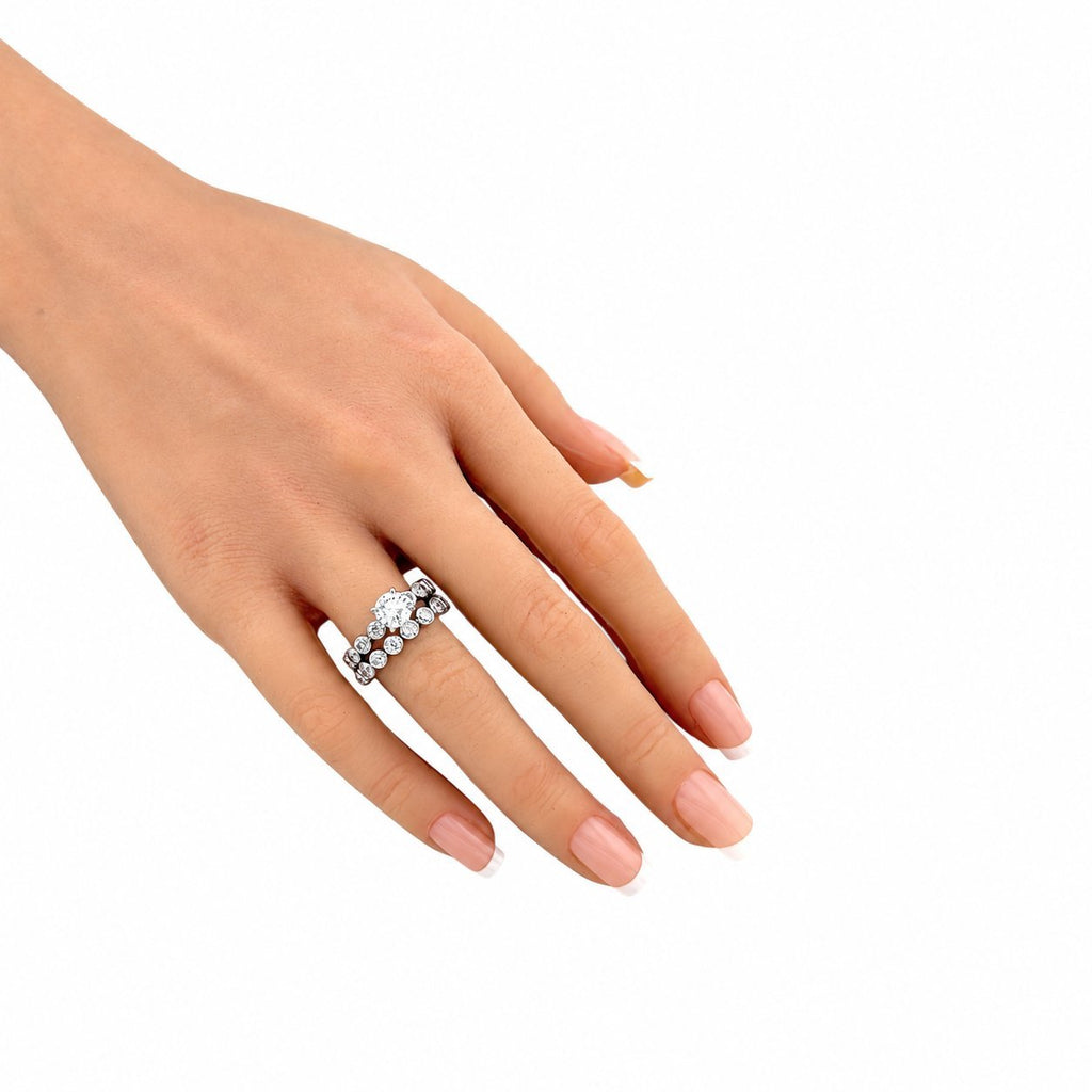 White gold diamond ring set on hand, slim band with small round stones