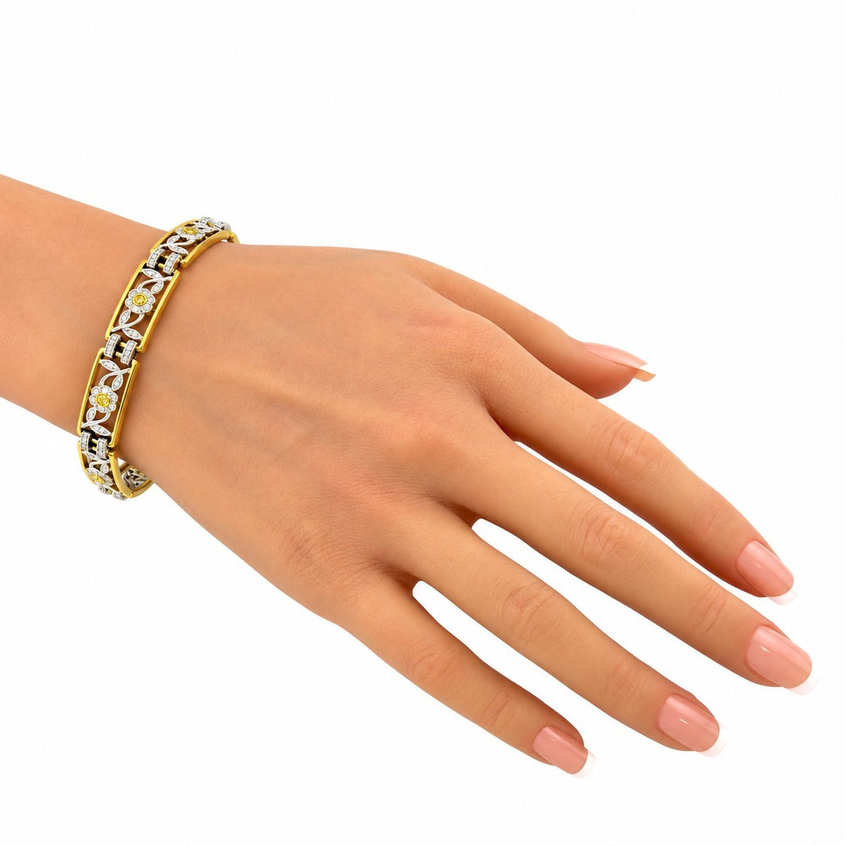 Diamond floral bracelet in yellow and white gold on hand with slim links
