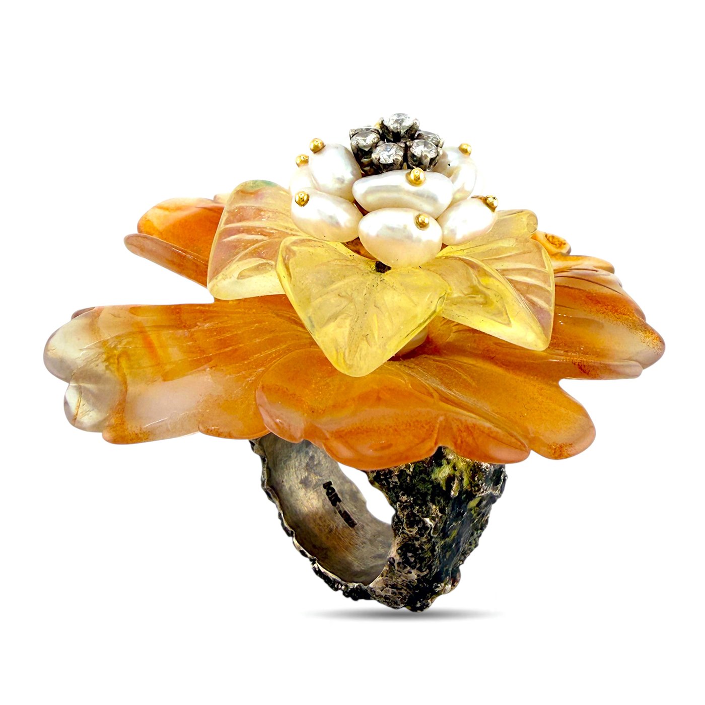 Gold and amber floral ring with pearl-like center, sparkling stones, and dark base