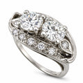 White gold diamond ring with oval center stone and pavé side accents