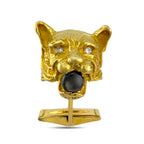 Single gold panther cufflink with dark round smoky stone and small diamond details