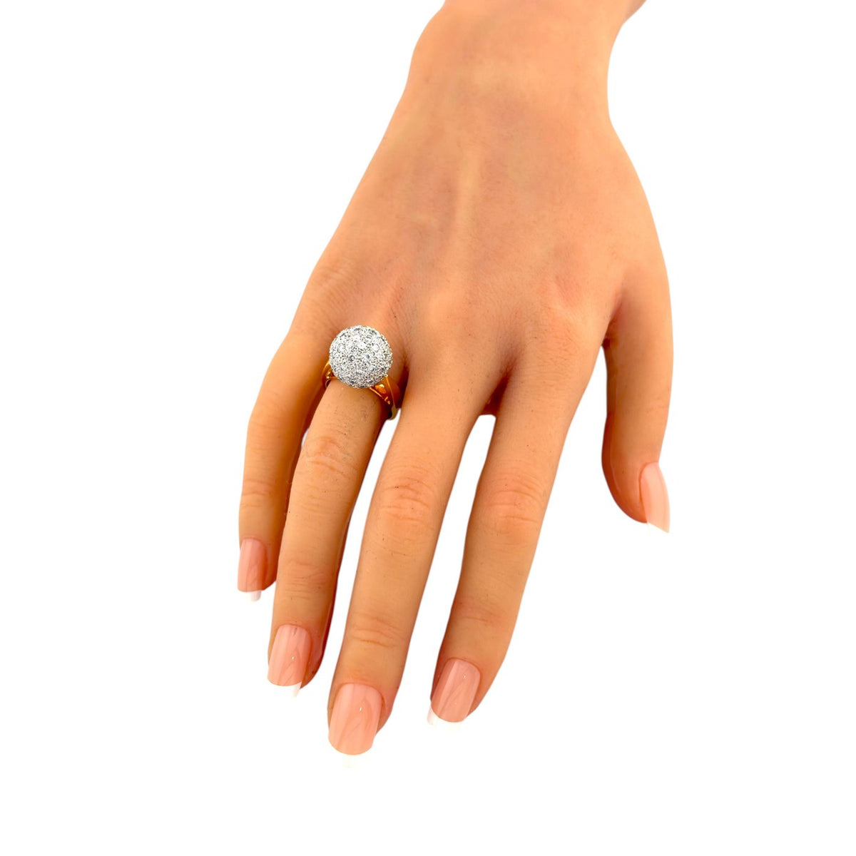 Diamond dome ring worn on a hand, showing its prominent round setting