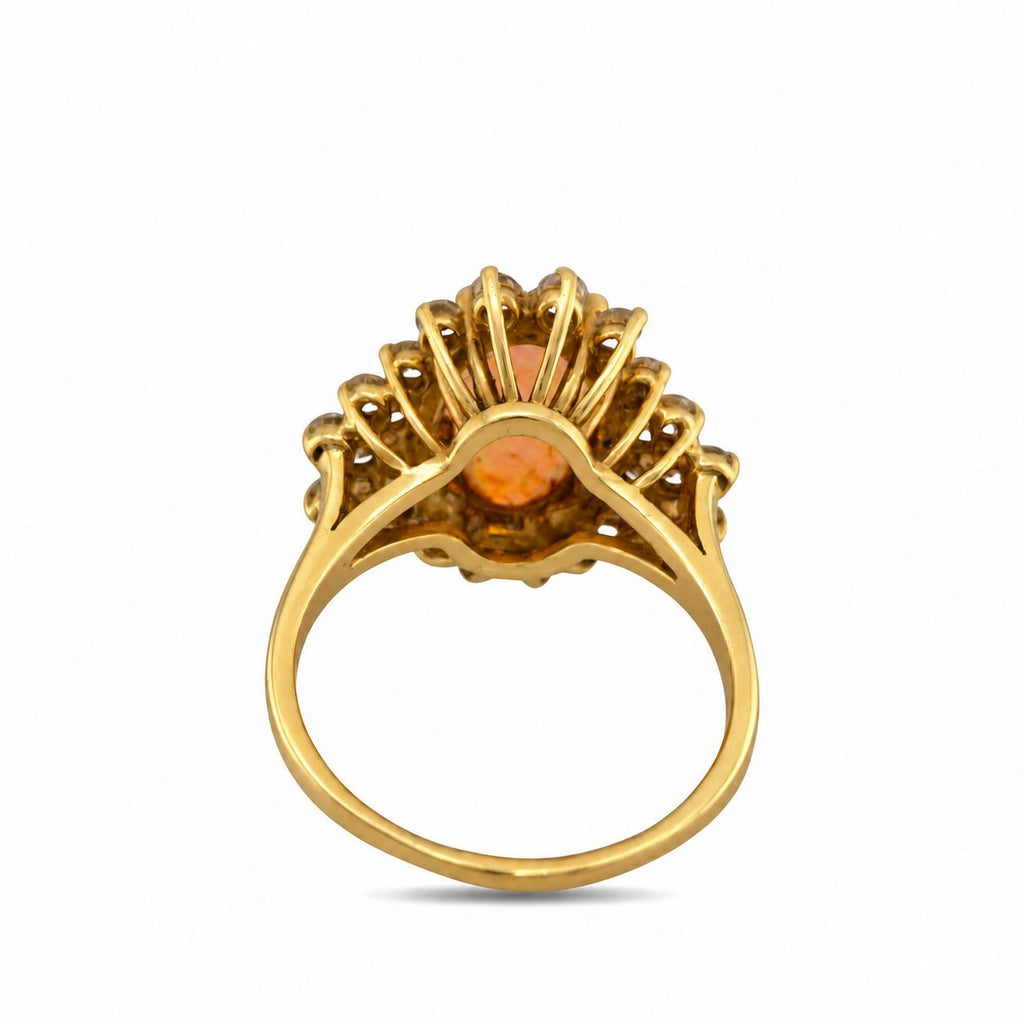 Back view of yellow gold gemstone ring with open prongs and round center stone