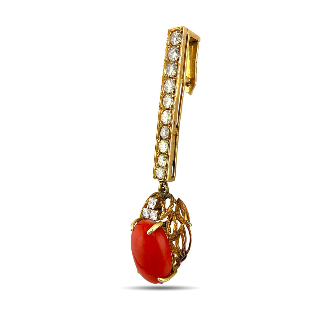 Angled view of coral drop pendant showing the stone and openwork gold setting