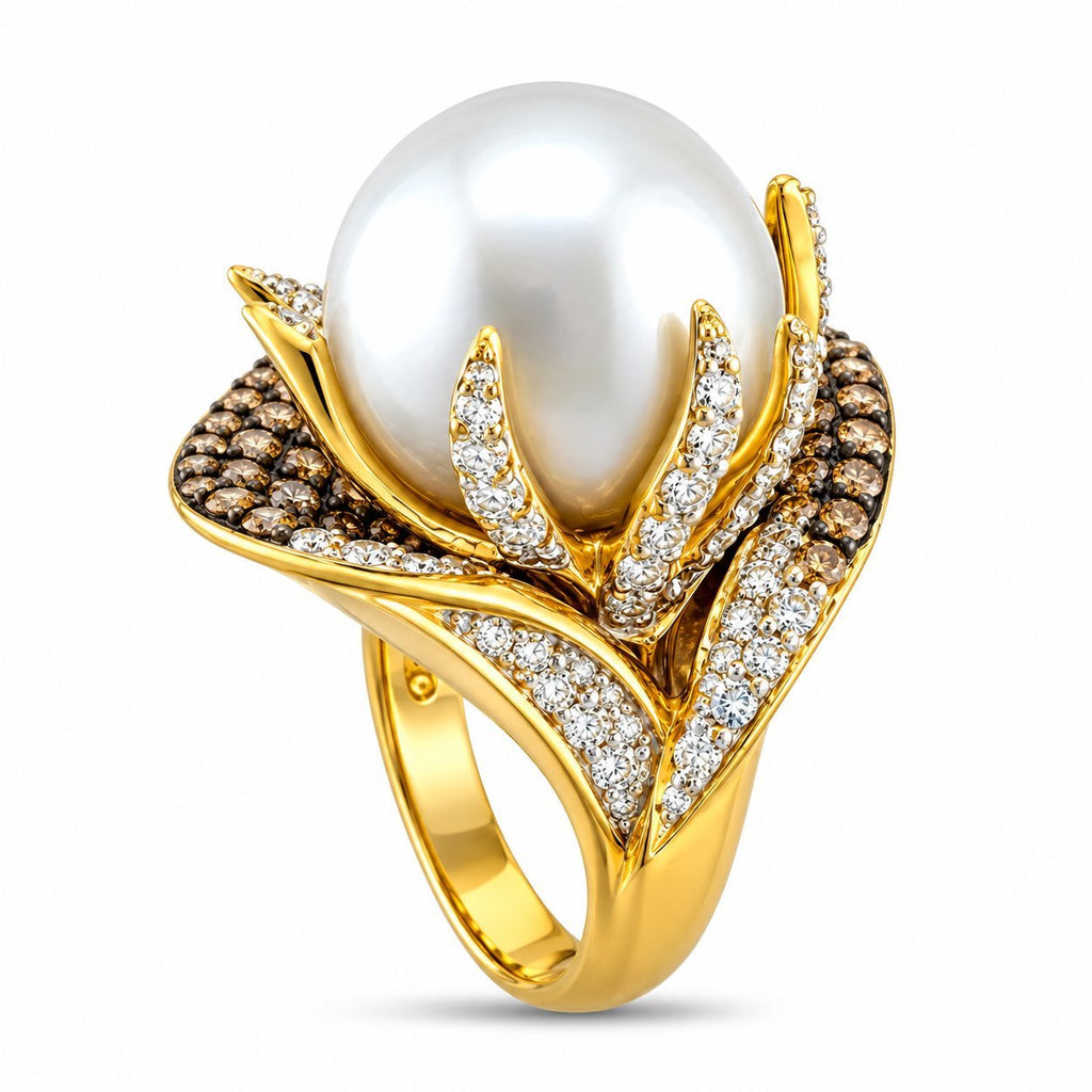 Sculptural 18K yellow gold ring with white pearl center and sparkling diamond accents