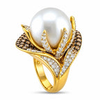 Sculptural 18K yellow gold ring with white pearl center and sparkling diamond accents