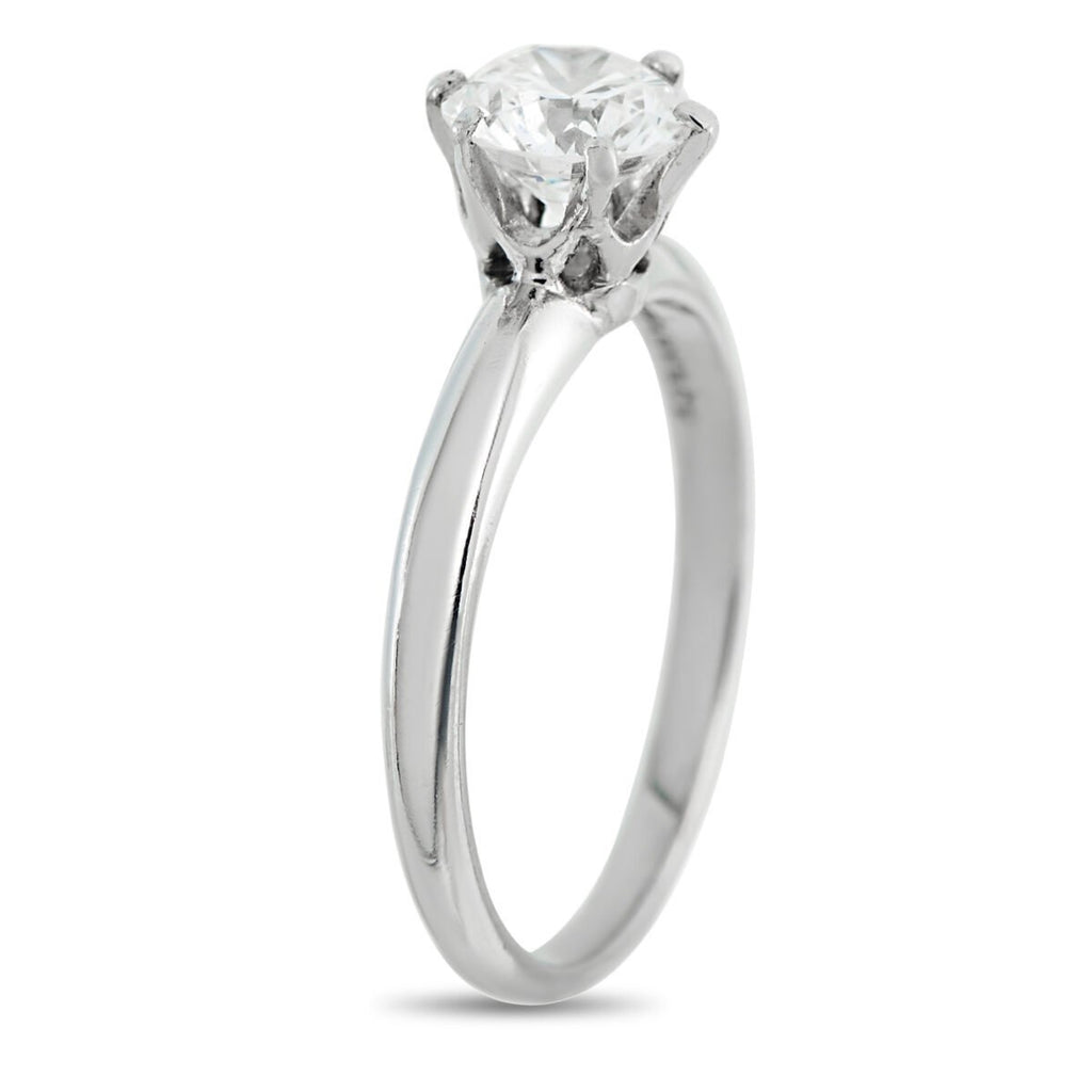 Platinum diamond solitaire ring side angle showing slim band and round center stone