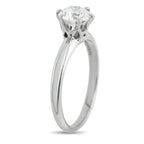Platinum diamond solitaire ring side angle showing slim band and round center stone