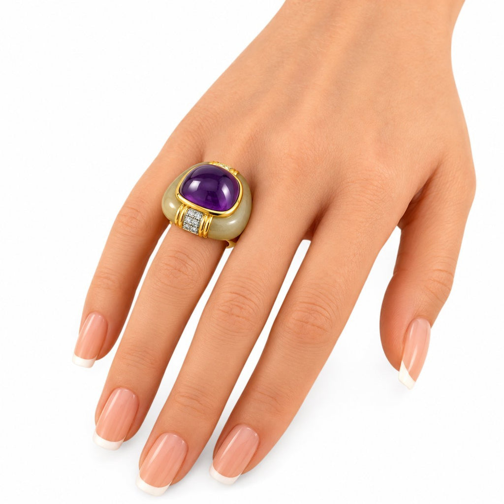 Amethyst and diamond ring on hand, yellow gold with green oval stone accents