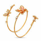 Rose gold butterfly cuff bracelet shown upright, with pearl inlays and diamonds