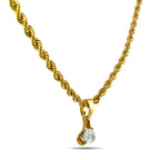 Gold rope necklace with floating teardrop diamond pendant in bezel