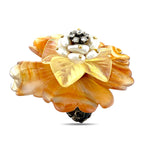 Amber flower ring with pearl-like center, gold petals, and small sparkling stones
