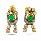 Emerald oval drop earrings in gold with diamond halo details and dangling round white stones