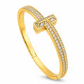 Tiffany & Co. 18K yellow gold diamond hinged bracelet with T motif
