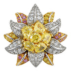 Diamond flower earring close-up with yellow center stones and pink and yellow accents