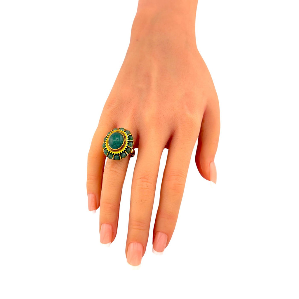 14K yellow gold jade cabochon ring on hand with green cabochon centerpiece