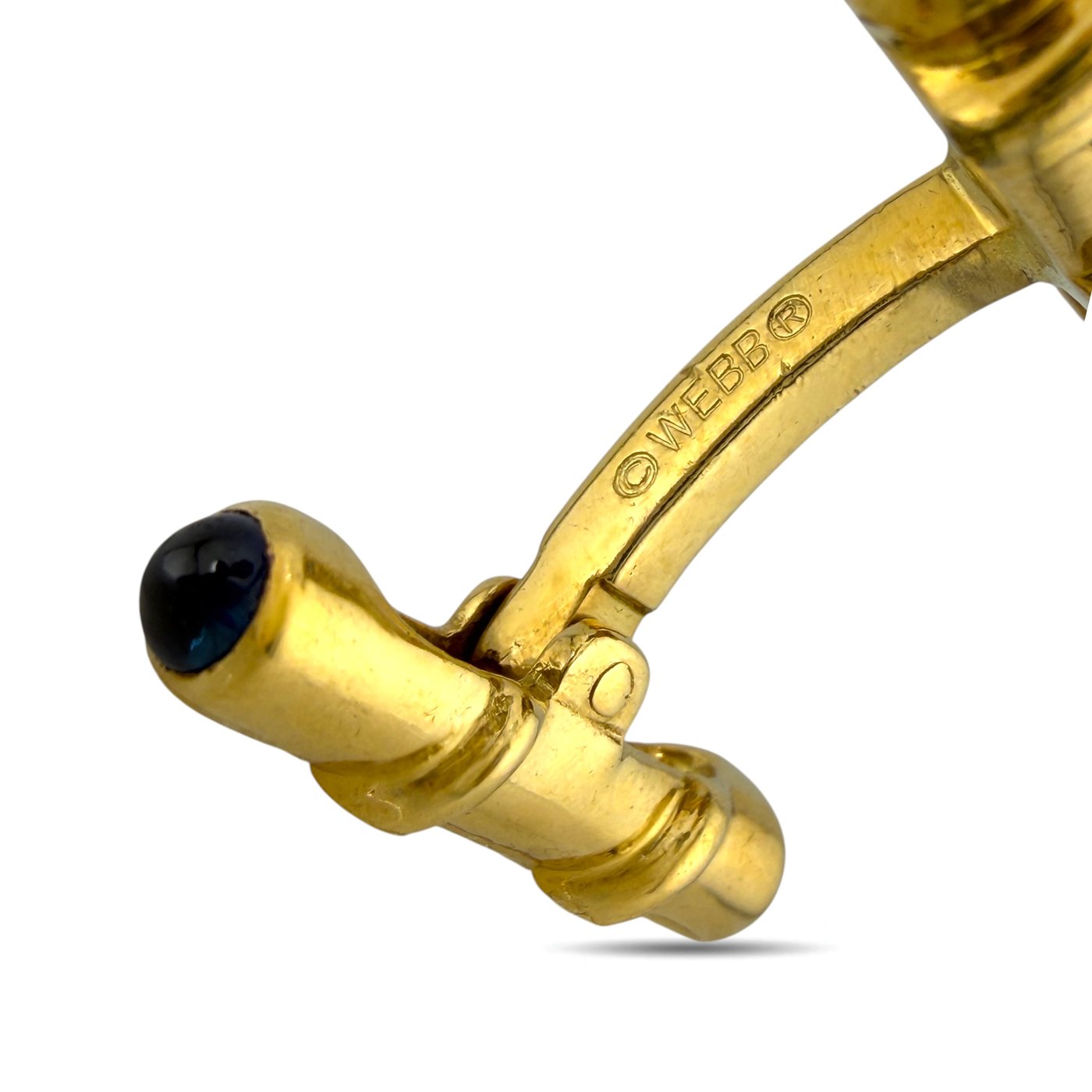 Gold-tone cufflink clasp detail with dark blue center and "WEBB" stamping
