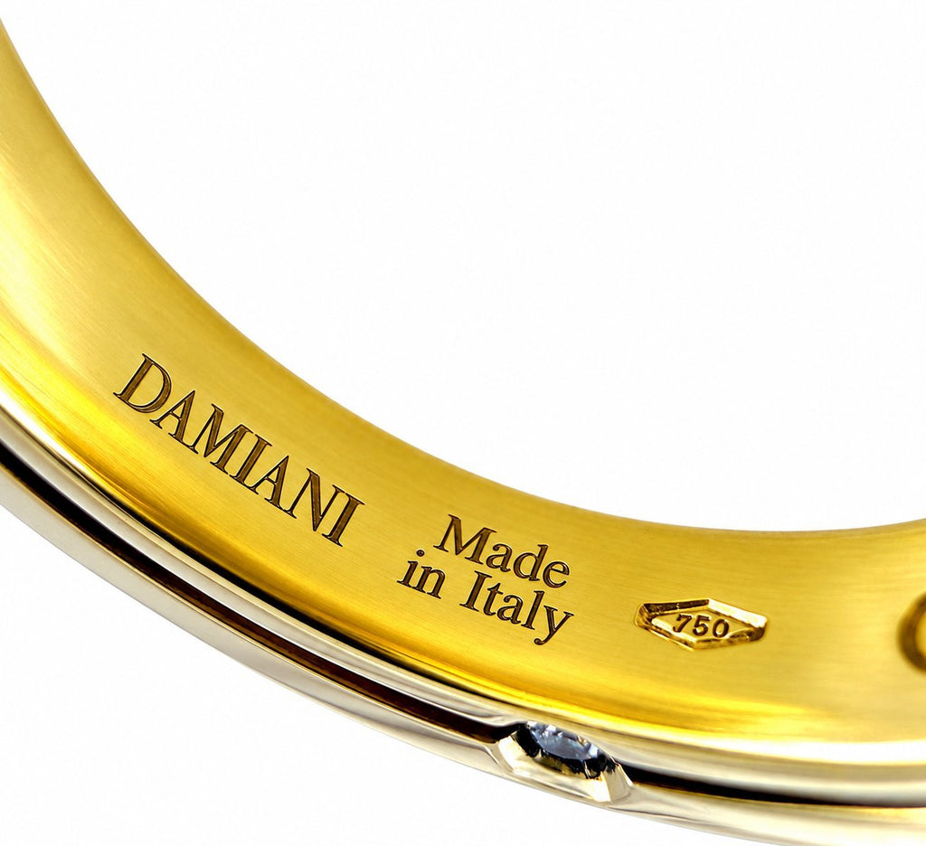 Damiani yellow gold inner band close-up with “Made in Italy” and 750 mark