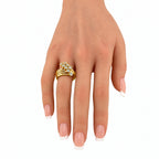 Sonia B. diamond swirl ring worn on a hand, showing its layered gold bands