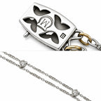 Rectangular enamel pendant with black hearts and “M” monogram on chain