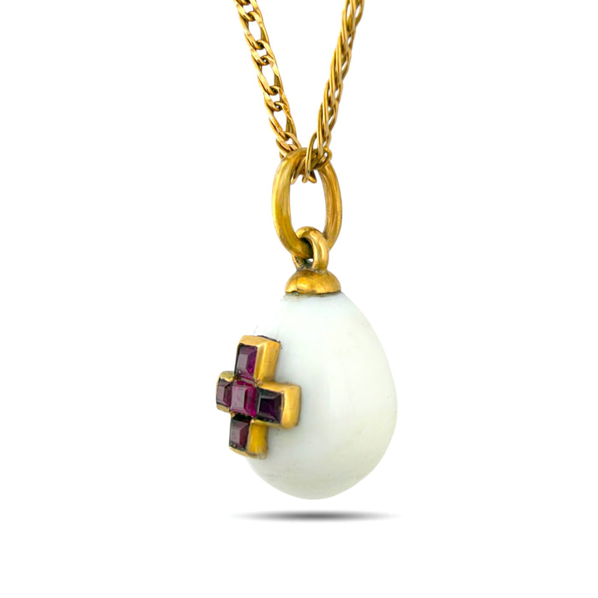Angled view of egg pendant showing the raised ruby cross setting