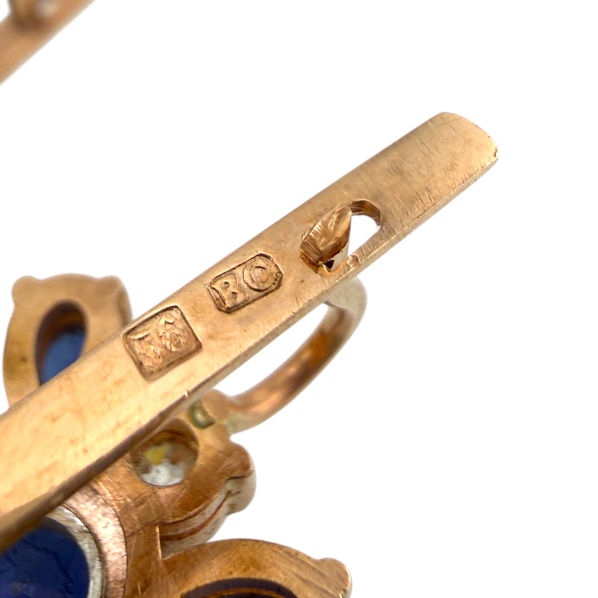 K. Faberge rose gold earrings with blue sapphire accents and engraved bar detail