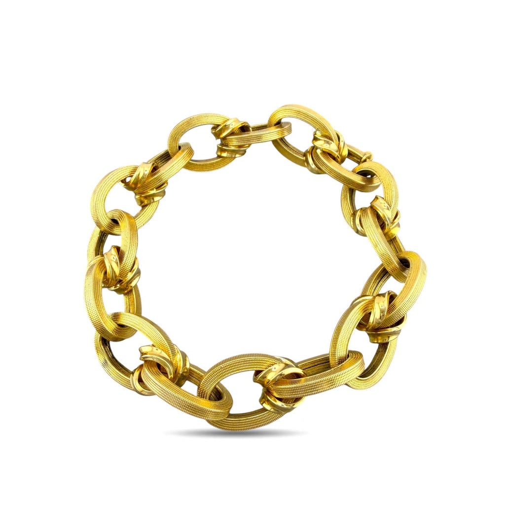 18K yellow gold textured oval link bracelet with oval, ribbed interlocking design