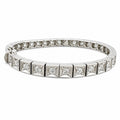 18K white gold tennis bracelet with rectangular panels of round diamonds